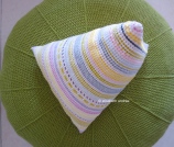crochet pyramid cushion on top of green pouf