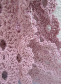close up of crochet lace stole scarf pink